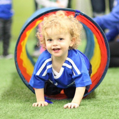 cute kid in tube sq 2 Arena Sports, Lil Kickers Soccer , lil kickers, soccer for kids, child development, best youth soccer class,